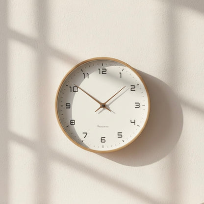 NordicTimber wooden wall clock mounted on clean wall, showcasing modern minimalist design