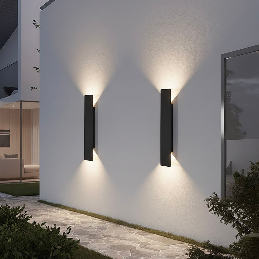 LED outdoor wall light providing bright illumination on exterior wall at night