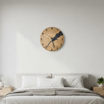 Wooden wall clock from the Nuvoro collection displayed in a modern bedroom