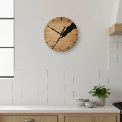 Wooden wall clock from the Nuvoro collection displayed in a modern kitchen