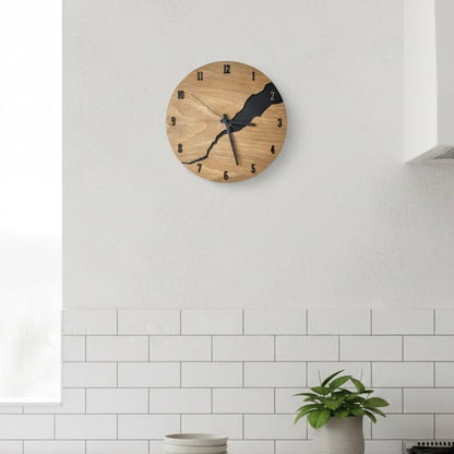 Modern wooden wall clock with minimalist design mounted on a modern kitchen wall