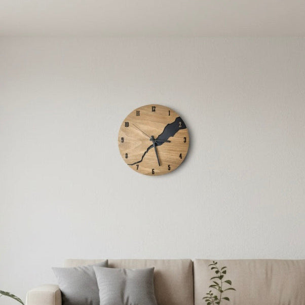 Modern wooden wall clock with minimalist design mounted on a neutral wall